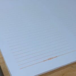 300 דפי שורה כתום עם עיטור עדין, נייר לבן איכותי 90 ג”ר גודל 15X21 ס”מ- A5